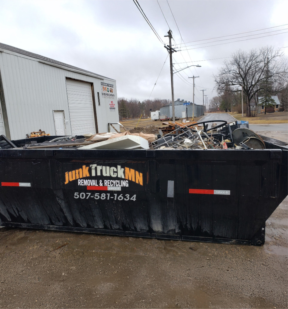 junk-truck-mn-dumpster-filled-metal-trash-recycling@2x